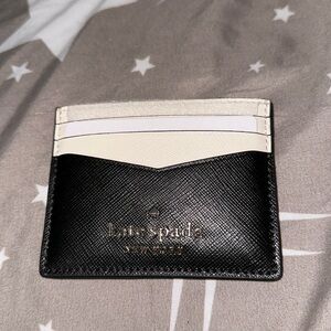 NWT Kate spade black and white card holder holds 8 card slots gold accents nice